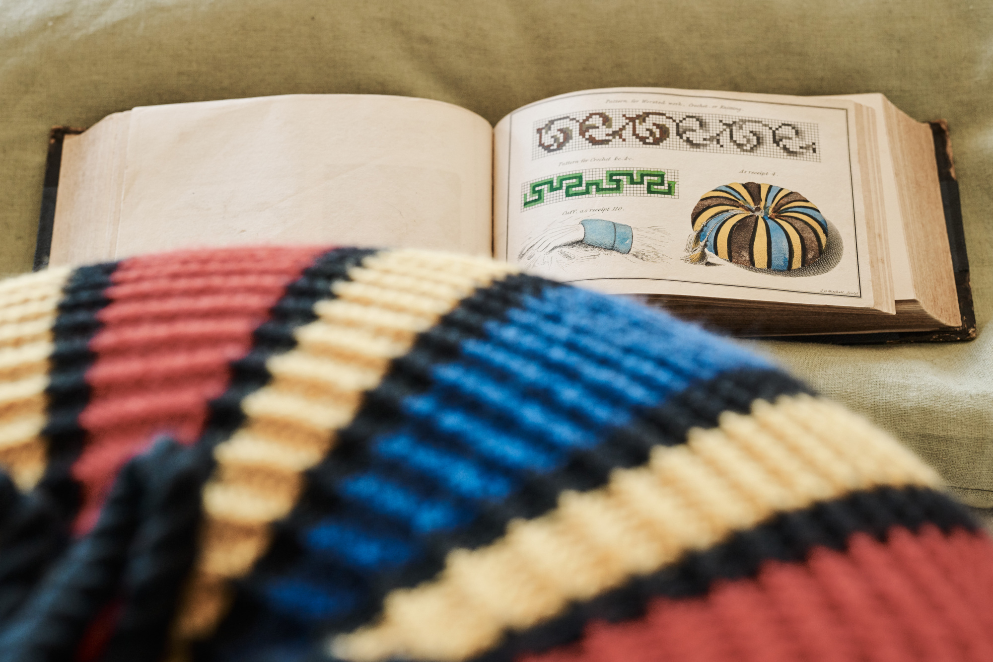 Knitted brioche with pattern from The Lady's assistant for executing useful and fancy designs in knitting, netting, and crochet work… Mrs Gaugain, 1841. Photo © Joshua Morris for Museums of History NSW